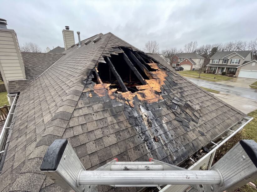 Roof and second floor burned open to the weather.